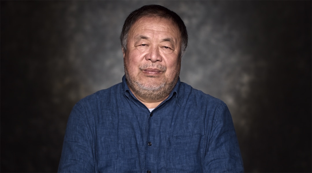 Artist Ai Weiwei in a studio wearing a blue shirt